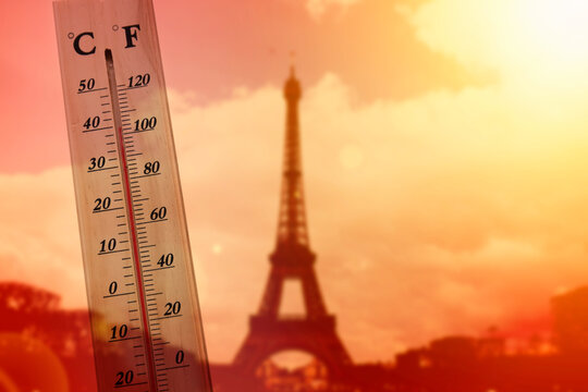 Thermometer in front of Paris skyline during heatwave in France