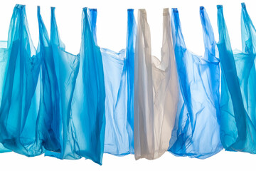 plastic waste concept: blue disposable shopping plastic bags isolated on white background