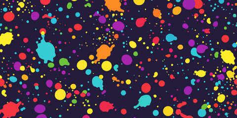 Vibrant multicolored paint splatters on a dark background