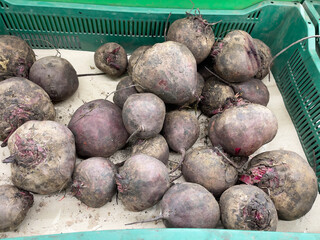 Freshly harvested beetroots in a green box at the farmers market