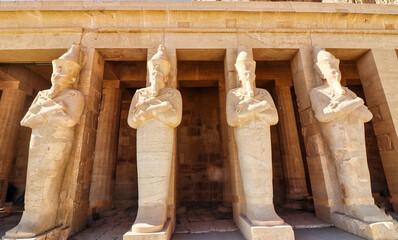 Massive statues of The Great Female Pharoah Hatshepsut with the crook and flail as ruler of Egypt...