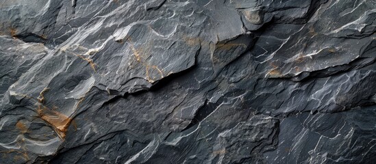 Natural black slate stone background pattern in high resolution Top view Copy space