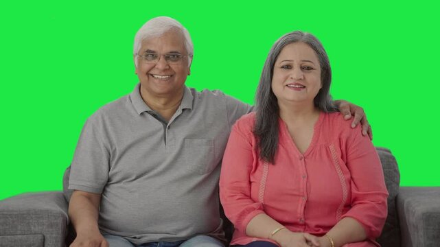 Happy Indian old couple smiling Green screen