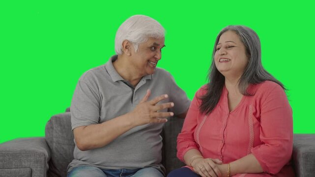 Happy Indian old couple talking to each other Green screen