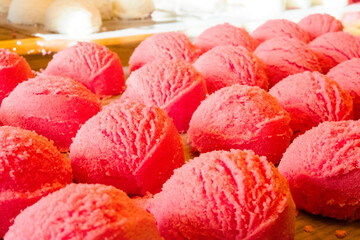 Rows of pink bath bombs.