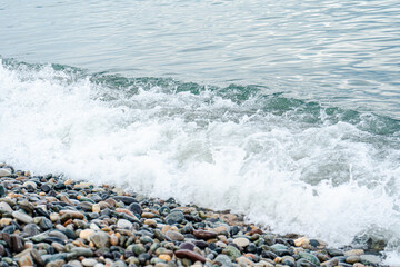 Sea waves on the pebbles shore