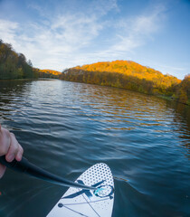 Paddleboarding on a Serene Autumn Lake