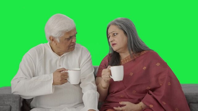 Old Indian couple drinking tea and enjoying Green screen