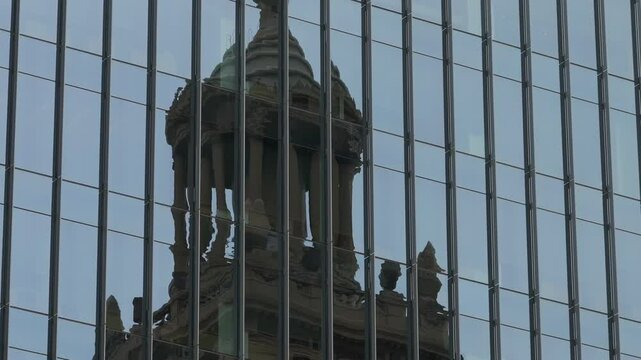 Niels Esperson building reflection on another skyscraper in Downtown Houston