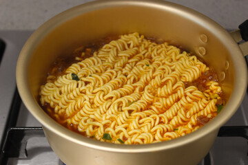 close up shot of cooking Korean ramen boiling