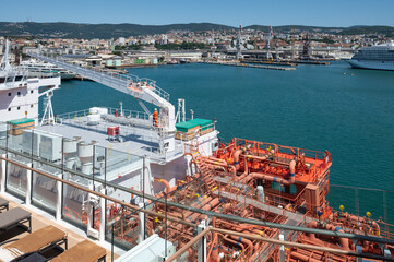 LNG tanker supplies cruise ship with clean energy with fewer emissions in the port of Trieste, Italy
