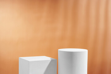 Various geometric shapes arranged artistically on a table with a warm, soft background during daylight