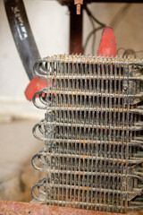 freezer condenser coil, heavily coated in dust and debris