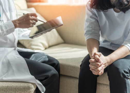 Panic attack menopause woman, stressful depressed PTSD patient with anxiety disorder having consultation psychotherapy treatment session in doctor clinic or psychologist counselor office