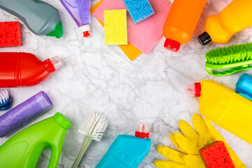 Cleaning service concept.Home cleaning product on a pink background. Bucket with household chemicals. cleaning supplies for home or office space.Early spring regular cleaning. Copy space