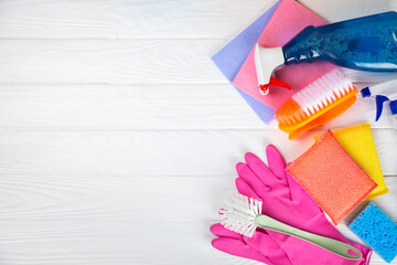 Cleaning service concept.Home cleaning product on a pink background. Bucket with household chemicals. cleaning supplies for home or office space.Early spring regular cleaning. Copy space