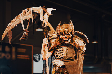 halloween death concept The image of death in black clothes with a scythe in his hands, a black...