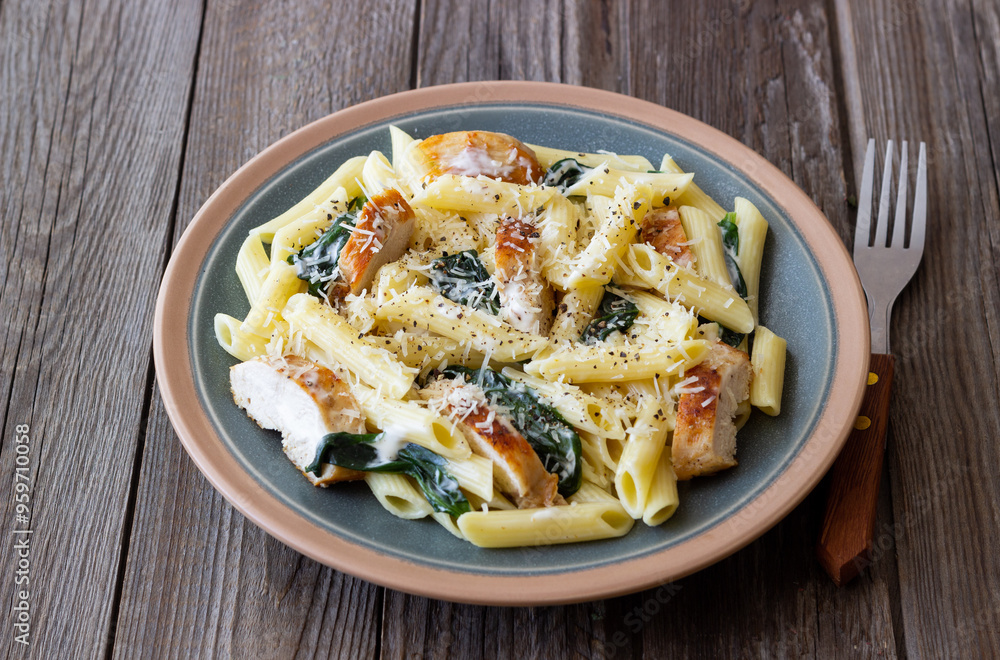 Wall mural pasta alfredo with chicken, spinach and cheese. italian food.