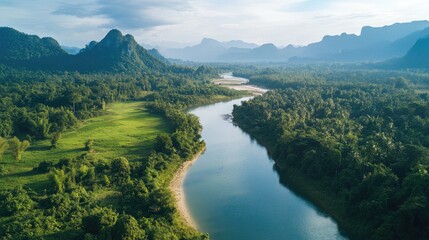 Fototapeta premium Aerial perspective of the serene Hin Boun River, with its karst landscapes and dense forests in central Laos.