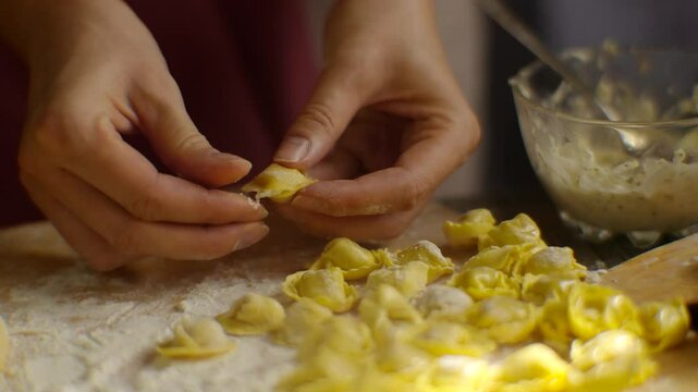 Cooking homemade ravioli pasta . Tortellini Mediterranean food