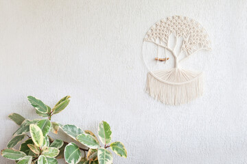 Close-up of hand made macrame texture pattern. Tree of life. ECO friendly modern knitting DIY natural decoration concept in interior. Handmade 100% cotton. Female hobby. Copy space.
