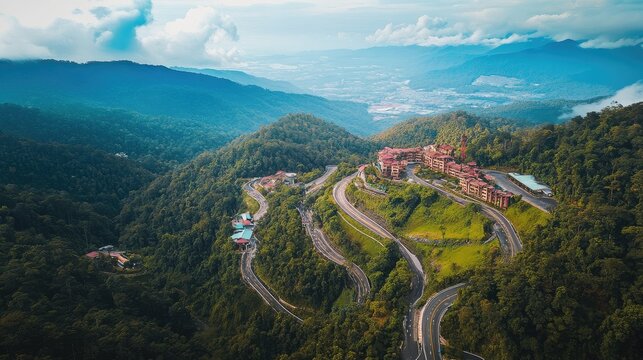 Bird's eye view of the winding roads through the dense forests and mountains of the Genting Highlands.