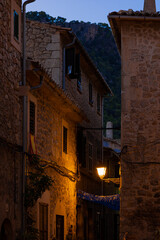 old alleys illuminated by a street lamp on a night in the village of valldemossa