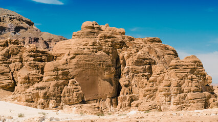 Fototapeta premium high rocky mountains against the blue sky and white clouds in the desert in Egypt Dahab South Sinai