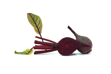 Close-up of fresh beetroot with vibrant red color and green leaves