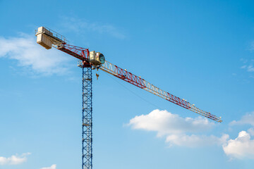 Construction crane working on large construction site