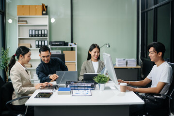 Group of Asian business meeting in planning design in creative business discussing work