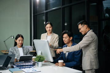 Group of Asian business meeting in planning design in creative business discussing work