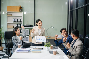 Business teamwork and collaboration among Asian professionals in a modern office