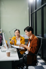 Business teamwork and collaboration among Asian professionals in a modern office