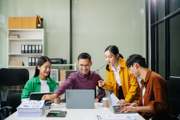 Business teamwork and collaboration among Asian professionals in a modern office