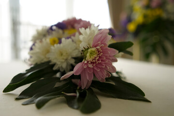 A Flower Bouquet On The Table As Decorated In Wedding Ceremony