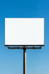 Obraz premium Outdoor billboard with a white canvas, supported by a strong metal structure, standing out against a pristine blue sky