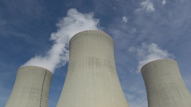 Nuclear power plant Temelin in hot summer weather. South bohemia in Czech republic, European union. Large nuclear power station proucing electricity.