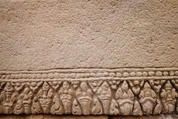Detail of sculpture on old red stone in a castle rock built on three thousand years, Prasat Hin Khao Phanom Rung, historical park.in Thailand.