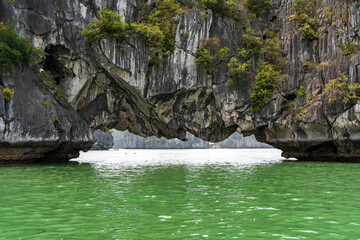 Hollow under Saddle Islet aka Hon Yen Ngua in Ha Long Bay, Quang Ninh, Vietnam