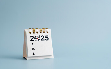 2025 New Year resolutions goal, plan, and action concept. Calendar and Note Pad Happy New year 2025. planning checklis target business and health