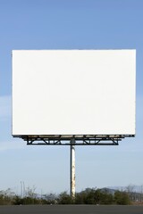 Obraz premium Outdoor billboard with a white canvas, supported by a strong metal structure, standing out against a pristine blue sky