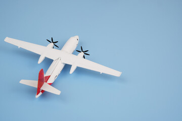 Airplane on blue background. Travel and transportation concept. Copy space for text.