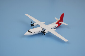 Airplane on blue background. Travel and transportation concept. 