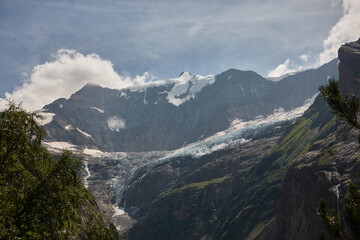 Hiking to the Gletscherschlucht glacier in Grindelwald, with imposing canyons, waterfalls and panoramic views of the valley. Swiss Alps