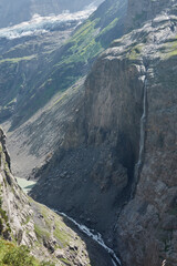 Hiking to the Gletscherschlucht glacier in Grindelwald, with imposing canyons, waterfalls and panoramic views of the valley. Swiss Alps