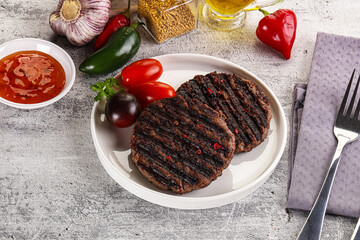 Grilled burger cutlet with sauce