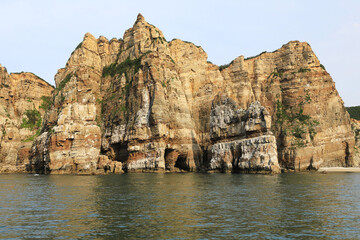 Seondaeam Rocks with geological stratum on the sea besides Dumujin Beach of Baengnyeongdo Island at Ongjin-gun, South Korea 