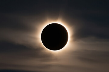 Obraz premium A beautiful solar eclipse captured at the moment when the Moon partially covers the Sun, creating an atmosphere of mystery and beauty