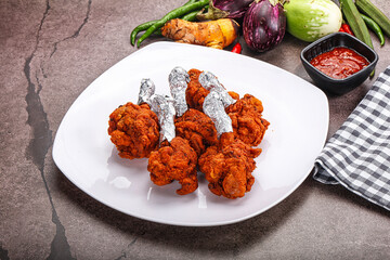 Indian cuisine glazed chicken lollipop